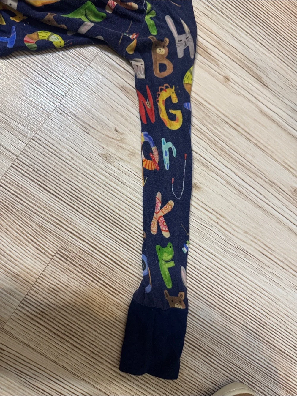 Little Sleepies Navy Alphabet Footed Pajamas with Multicolor Letters